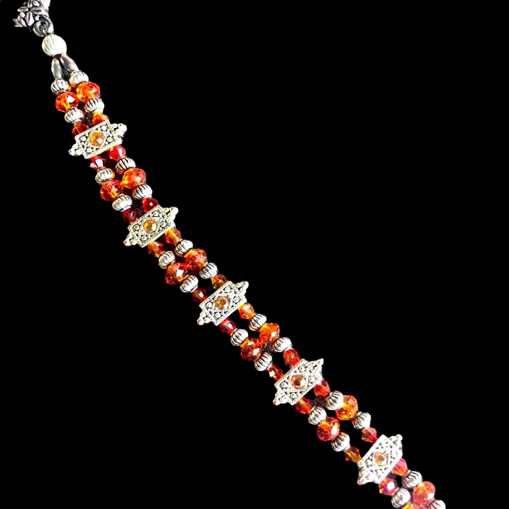 Orange beaded bracelet.